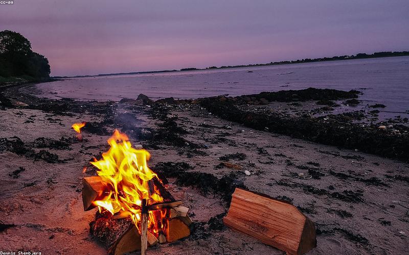 Friends cooking together outdoors